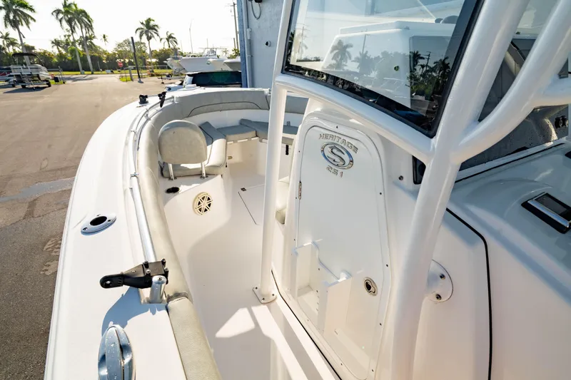 Slide: The Image of 2020 Sportsman Heritage 251 Center Console boat interior with seating and console view. - 7