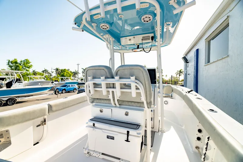 Slide: The Image of 2020 Sportsman Heritage 251 Center Console boat with blue T-top and dual seating. - 8