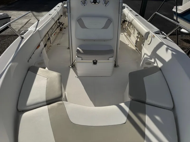 Slide: The Image of 2006 Boston Whaler 210 Outrage boat interior with seating and console. - 6