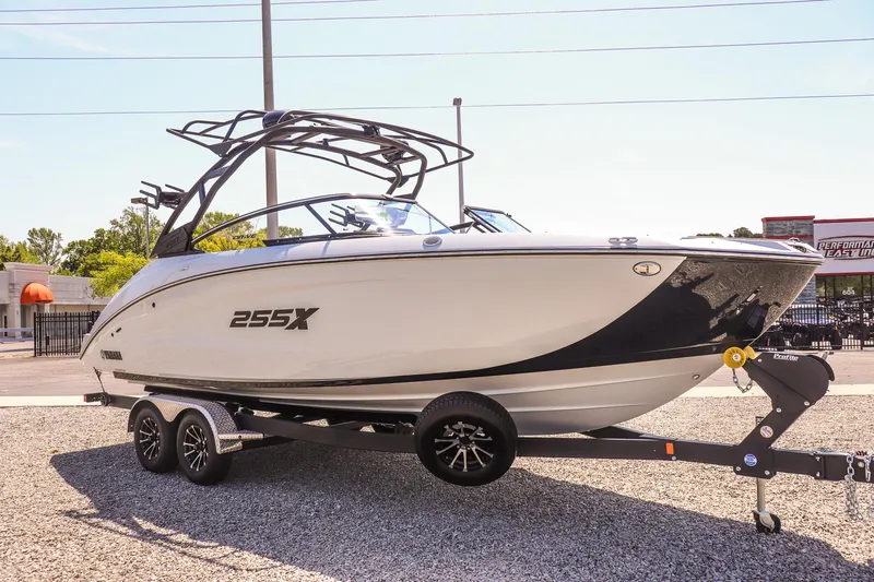 Slide: The Image of 2024 Yamaha Boats 255XD on trailer, sleek design, parked outdoors. - 11
