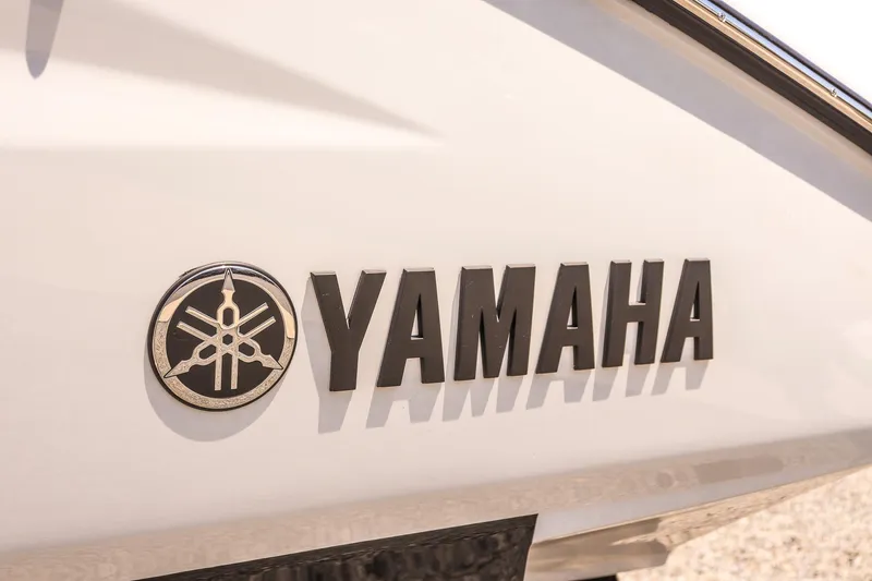 Slide: The Image of 2024 Yamaha Boats 255XD logo on white hull. - 14