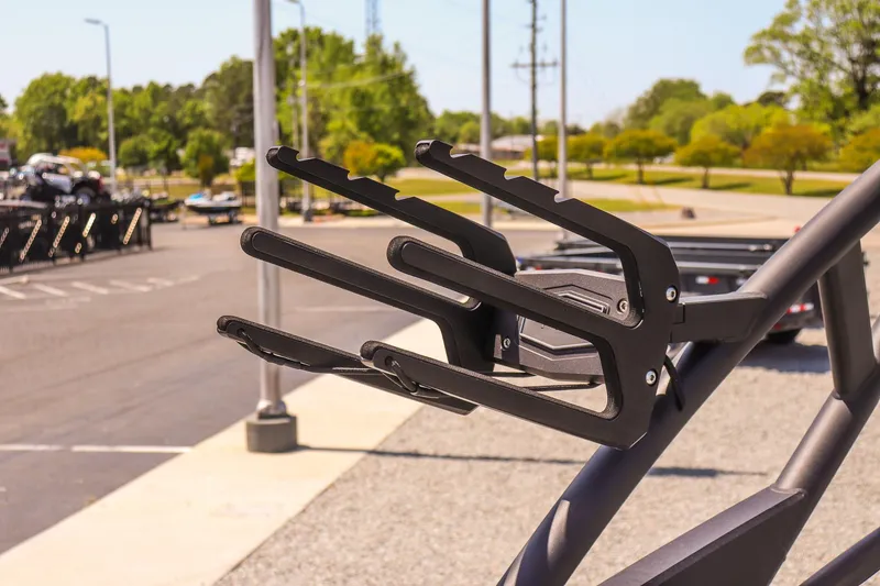 Slide: The Image of 2024 Yamaha Boats 255XD wakeboard rack in a sunny parking lot. - 28