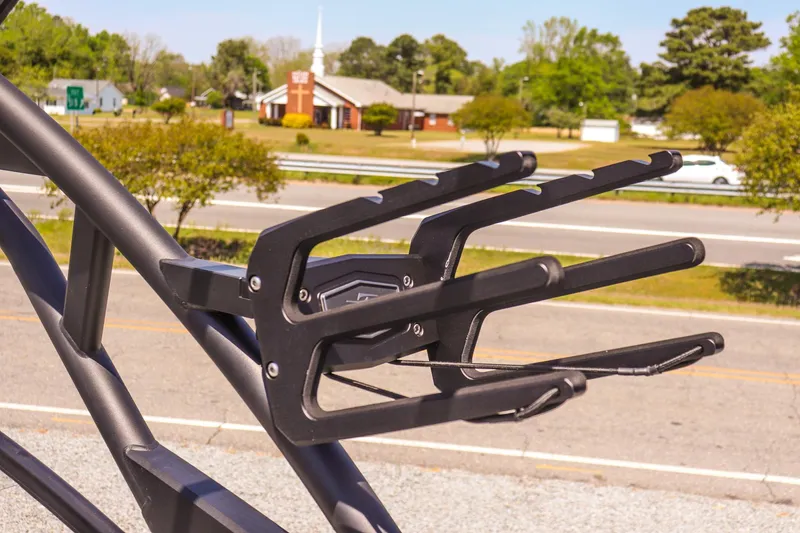 Slide: The Image of 2024 Yamaha Boats 255XD wakeboard rack against a suburban backdrop. - 29