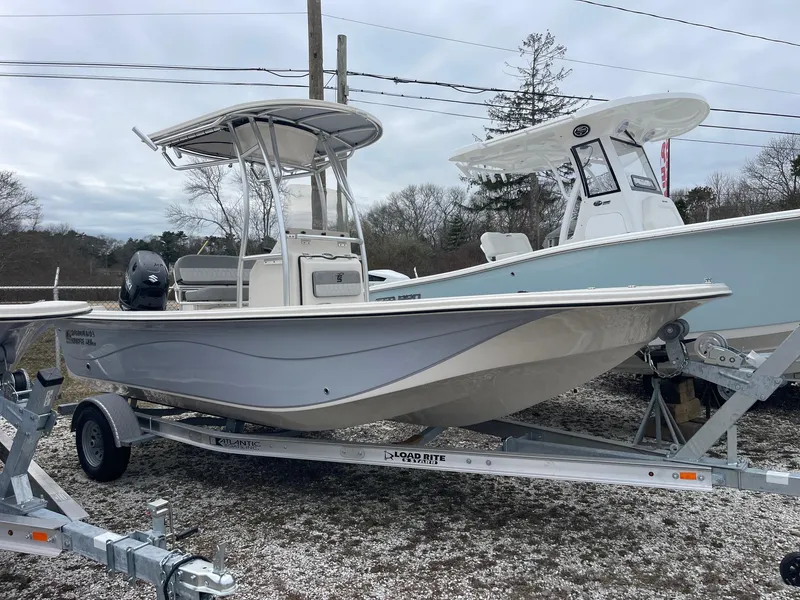 Slide: The Image of 2025 Carolina Skiff 21 LS boat on trailer, parked outdoors. - 1