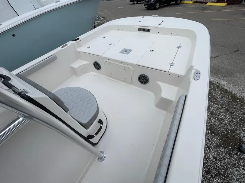 Slide: The Image of 2025 Carolina Skiff 21 LS boat interior with seating and storage compartments. - 17