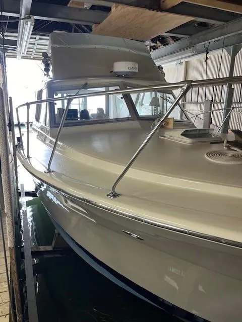 Slide: The Image of 1970 Chris-Craft Commander Sport Cruiser interior with patterned sofa and cushions. - 4