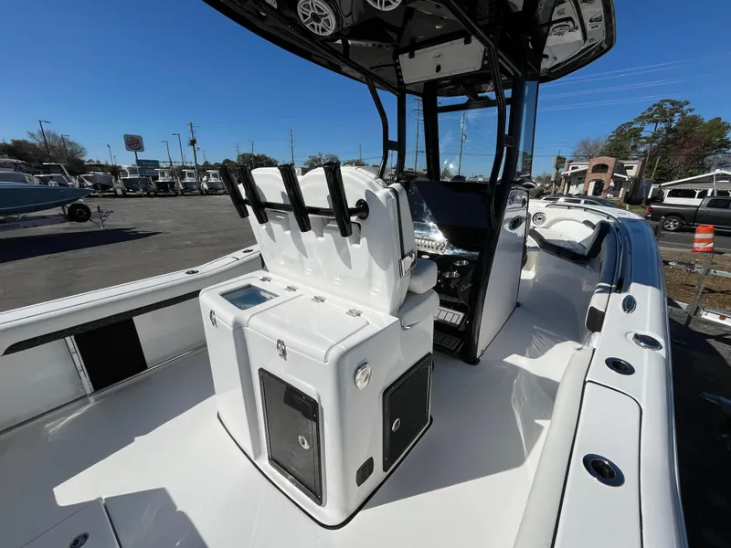 Slide: The Image of 2024 Tidewater 280 CC Adventure boat interior with seating and control panel. - 9