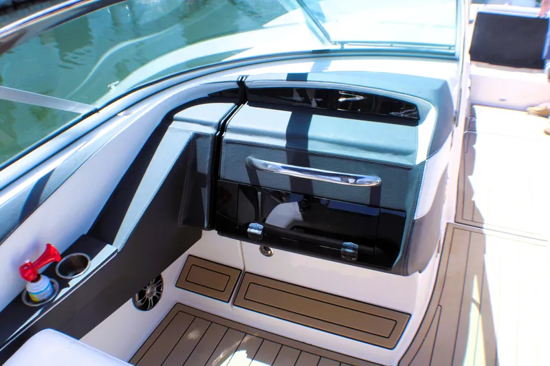 Slide: The Image of 2022 Regal 33 OBX boat interior with sleek dashboard and modern design. - 2