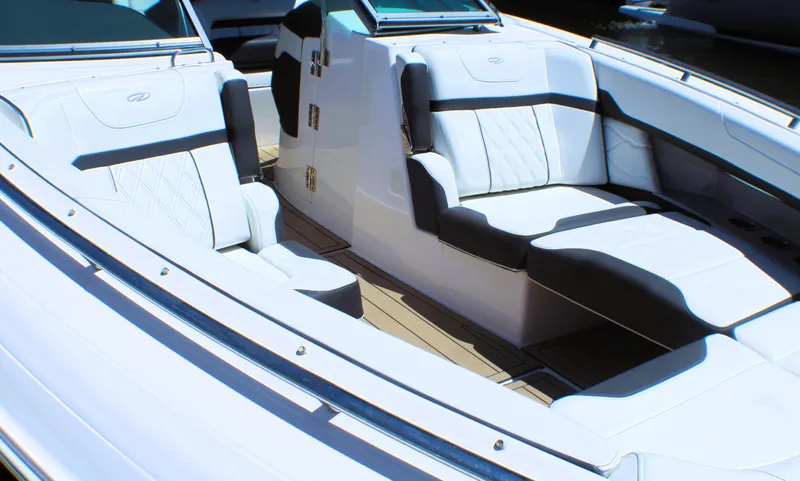 Slide: The Image of 2022 Regal 33 OBX boat interior with luxurious seating and modern design. - 9