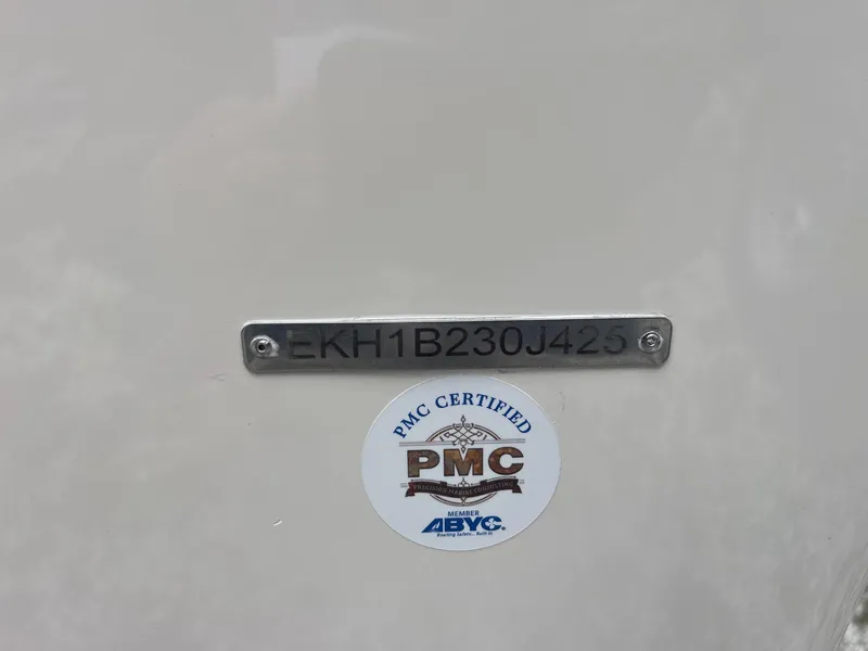 Slide: The Image of 2025 Carolina Skiff 162 JLS with PMC certification label and serial number plate. - 11