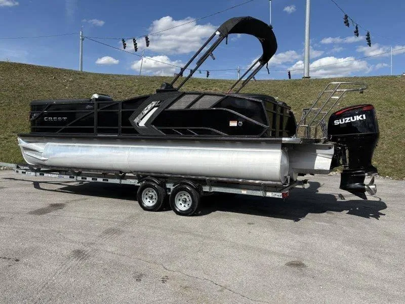 Slide: The Image of 2023 Crest Caribbean RS 230 SLC pontoon boat on trailer with Suzuki outboard motor. - 13