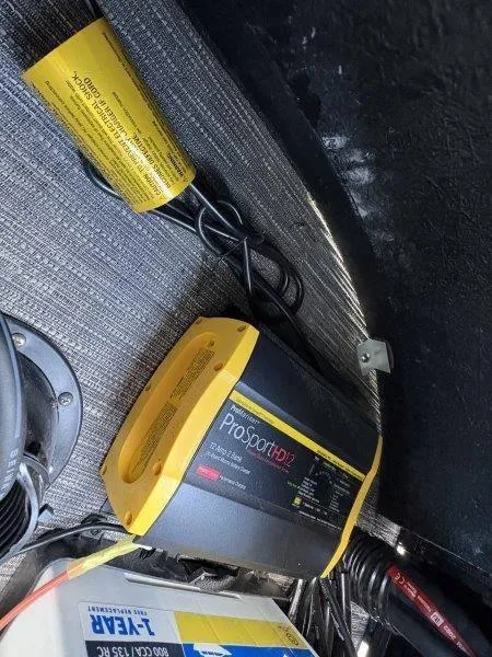 Slide: The Image of Battery charger inside a 2023 Crest Caribbean RS 230 SLC boat. - 18