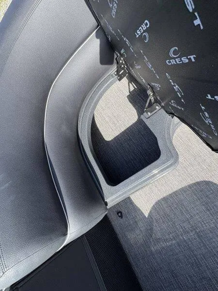 Slide: The Image of 2023 Crest Caribbean RS 230 SLC interior seating with storage compartment. - 19