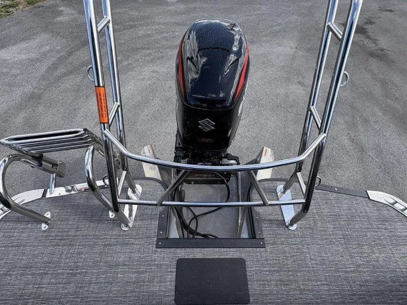 Slide: The Image of 2023 Crest Caribbean RS 230 SLC boat with Suzuki outboard motor, rear view. - 20