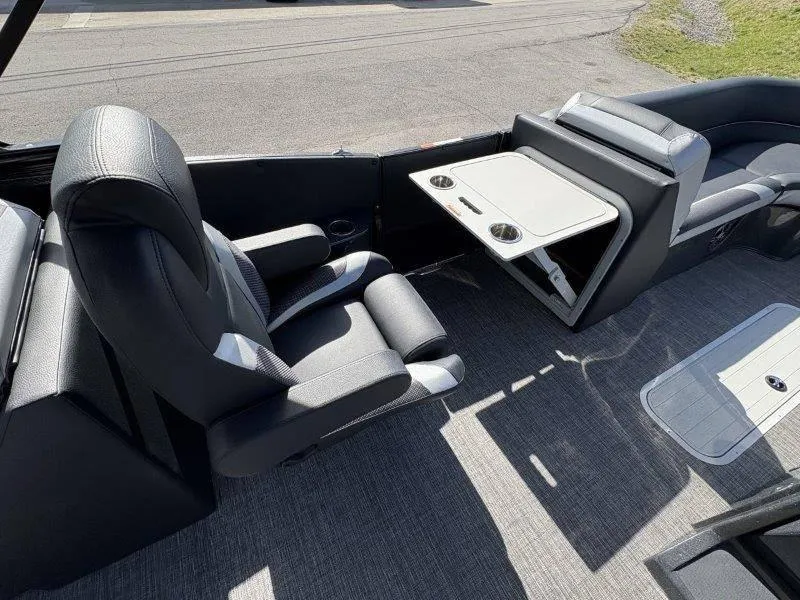 Slide: The Image of 2023 Crest Caribbean RS 230 SLC boat interior with seating and foldable table. - 21