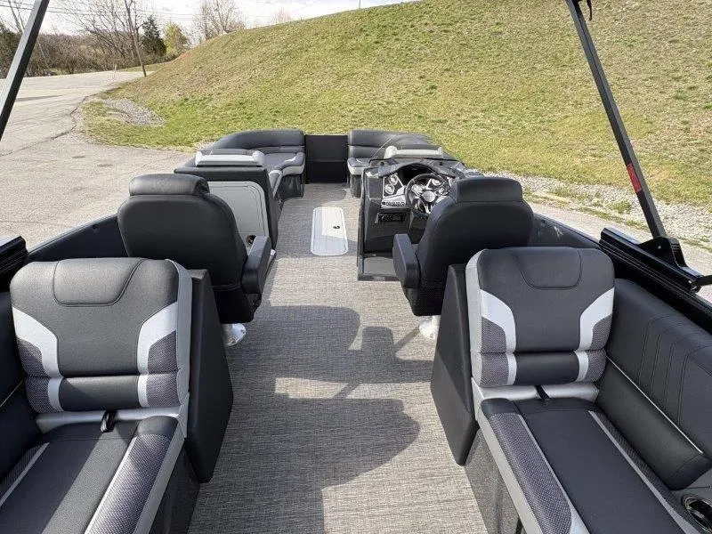 Slide: The Image of 2023 Crest Caribbean RS 230 SLC boat interior with luxurious seating and modern dashboard. - 23