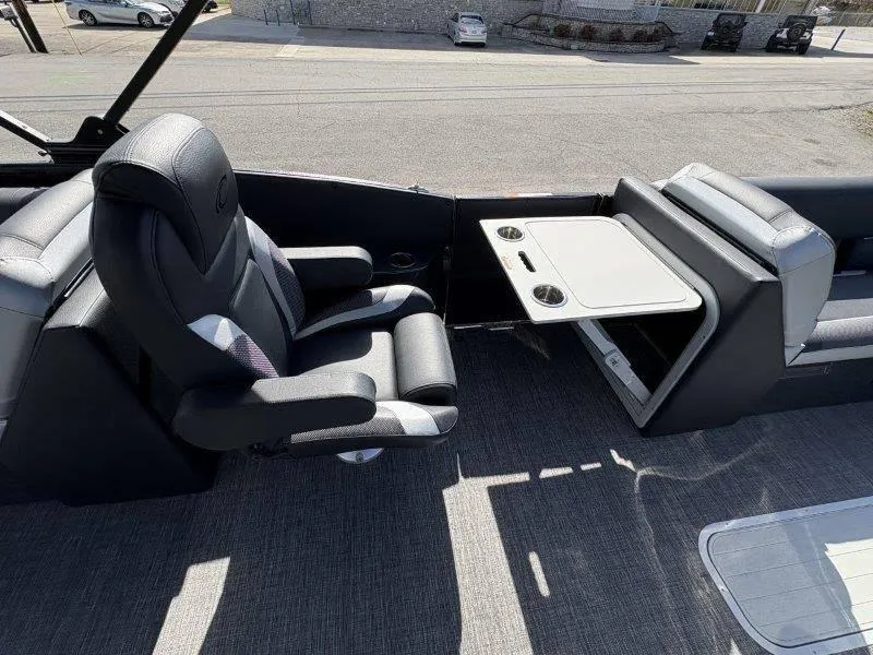 Slide: The Image of 2023 Crest Caribbean RS 230 SLC boat interior with luxurious seating and table setup. - 25