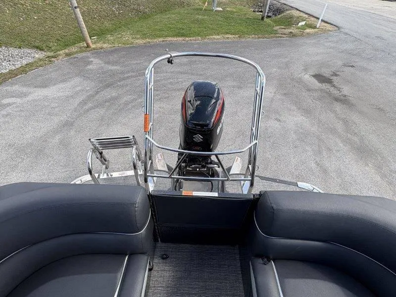 Slide: The Image of 2023 Crest Caribbean RS 230 SLC boat with Suzuki outboard motor, rear view. - 27