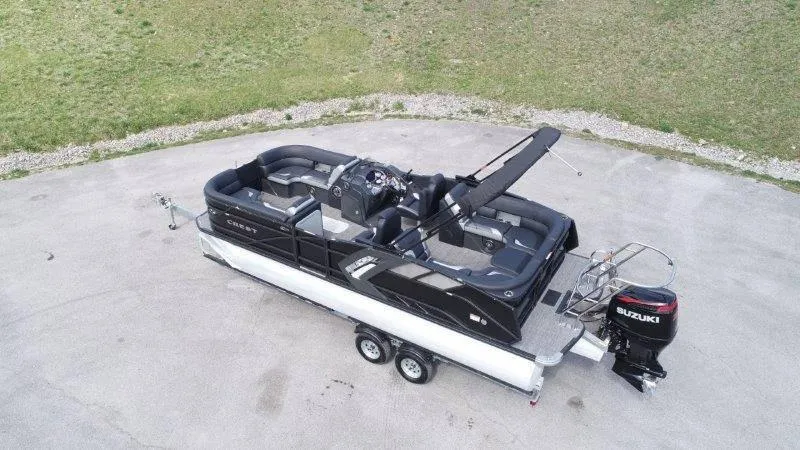 Slide: The Image of 2023 Crest Caribbean RS 230 SLC pontoon boat with Suzuki outboard motor on trailer. - 4