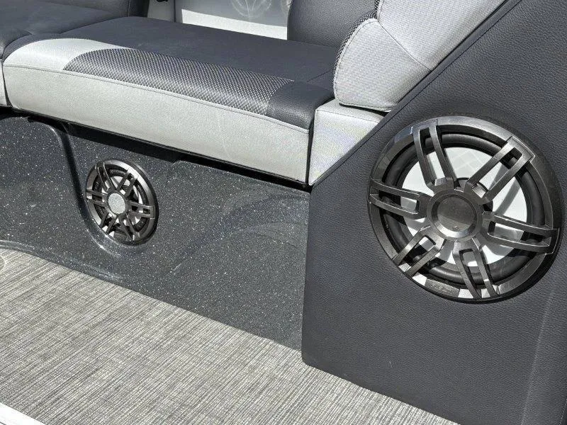 Slide: The Image of 2023 Crest Caribbean RS 230 SLC interior with speakers and cushioned seating. - 43