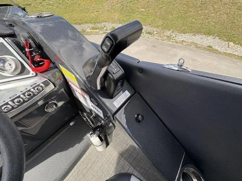 Slide: The Image of 2023 Crest Caribbean RS 230 SLC boat control panel with throttle lever and dashboard. - 48