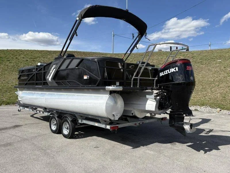 Slide: The Image of 2023 Crest Caribbean RS 230 SLC pontoon boat with Suzuki outboard motor on trailer. - 8