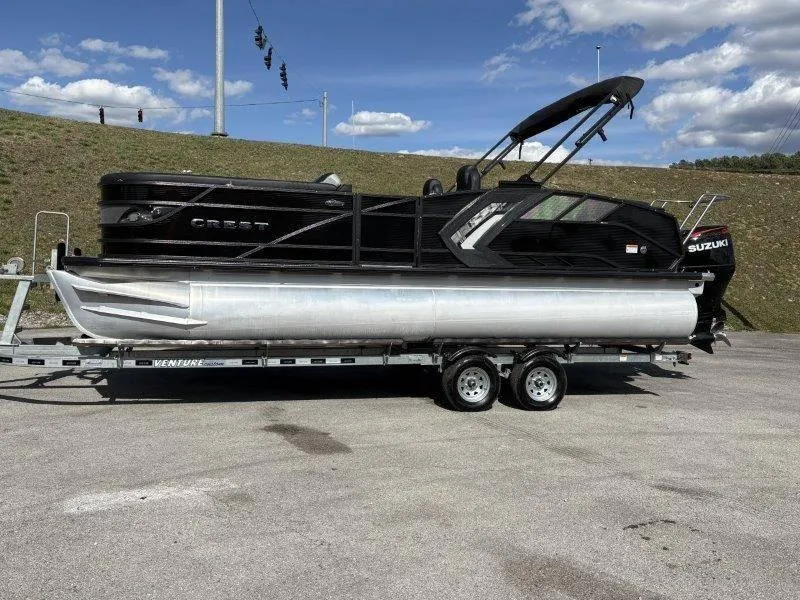 Slide: The Image of 2023 Crest Caribbean RS 230 SLC pontoon boat on trailer, sunny day. - 9