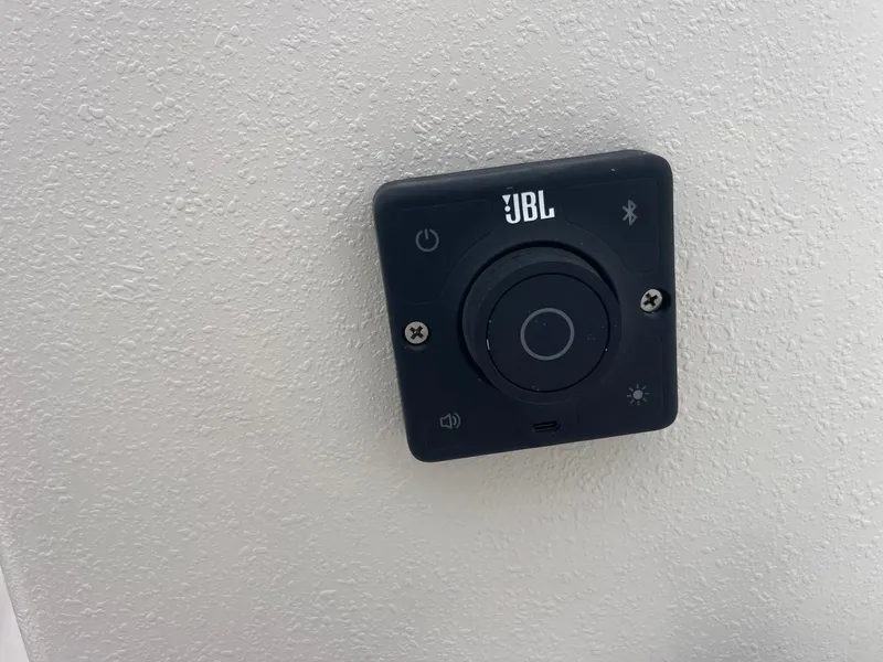 Slide: The Image of JBL control panel on 2025 Carolina Skiff EV218 Sea Skiff boat. - 11