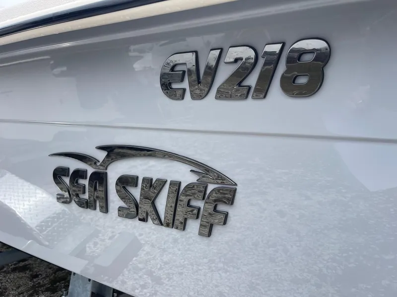 Slide: The Image of 2025 Carolina Skiff EV218 Sea Skiff logo on boat hull. - 16
