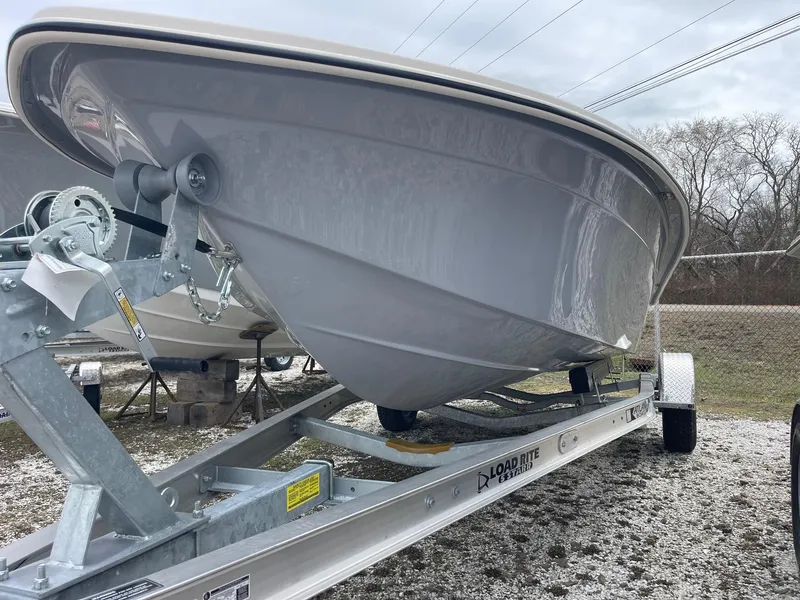 Slide: The Image of 2025 Carolina Skiff EV218 Sea Skiff on trailer, showcasing sleek hull design. - 3