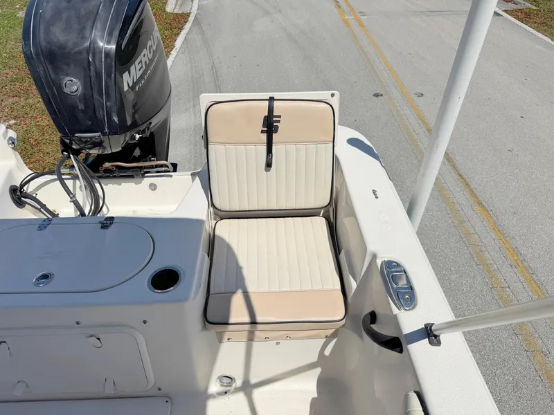 Slide: The Image of 2020 Carolina Skiff 19 LS boat interior with seating and Mercury engine. - 18