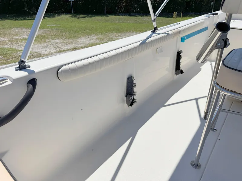 Slide: The Image of 2020 Carolina Skiff 19 LS interior view, showcasing seating and railing details. - 23