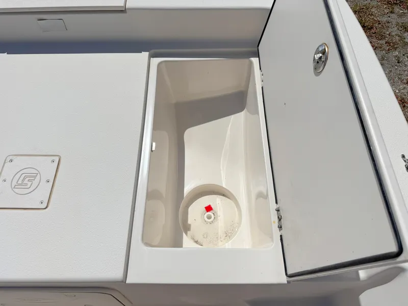 Slide: The Image of Open storage compartment on a 2020 Carolina Skiff 19 LS boat. - 9