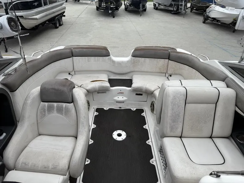 Slide: The Image of 2007 Yamaha Boats AR 230 interior with white seating and black flooring. - 11