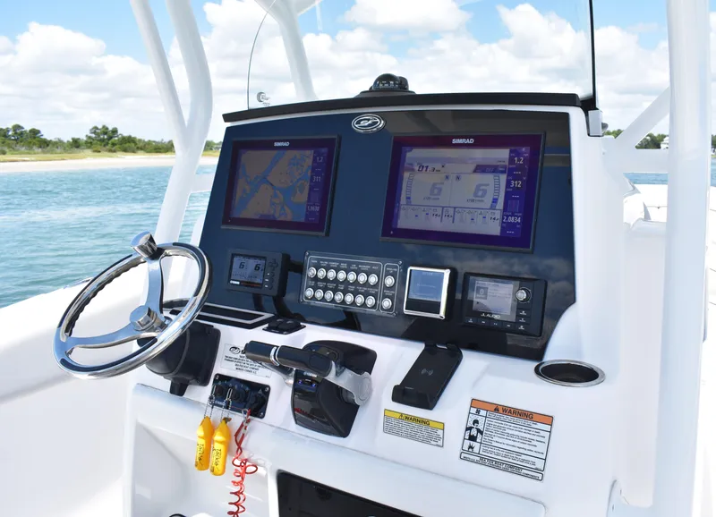 Slide: The Image of Helm of 2020 Sea Fox 288 Commander with dual navigation screens and controls. - 19