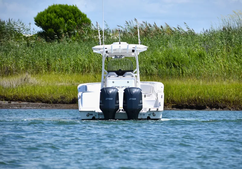 Slide: The Image of 2020 Sea Fox 288 Commander boat with dual engines on a calm waterway. - 6