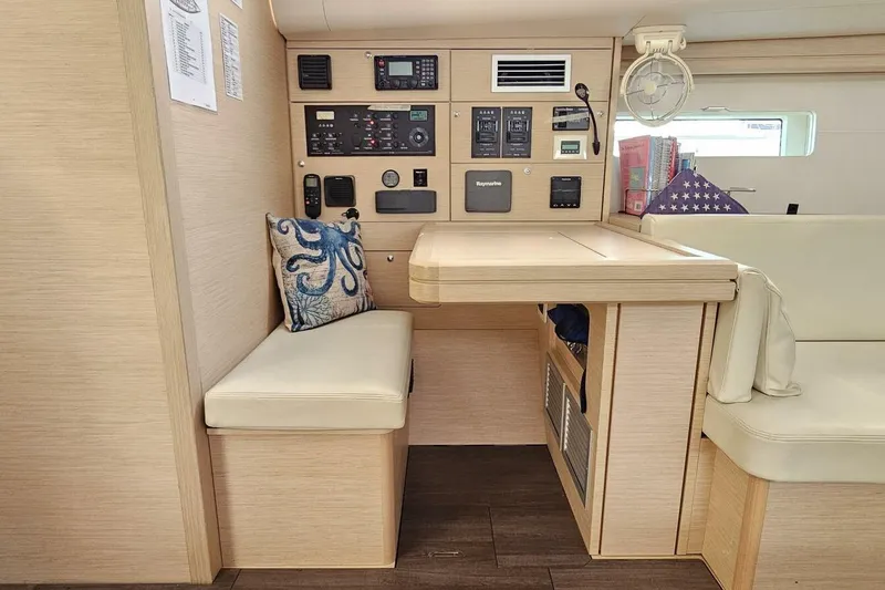 Slide: The Image of Interior of 2017 Jeanneau Sun Odyssey 51 yacht with navigation station and seating area. - 8