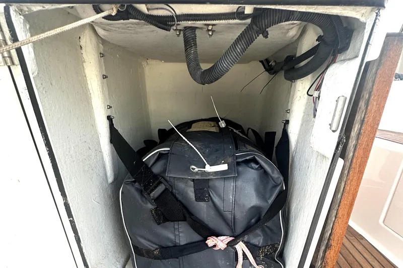 Slide: The Image of Storage compartment on a 2017 Jeanneau Sun Odyssey 51 sailboat with secured equipment. - 38