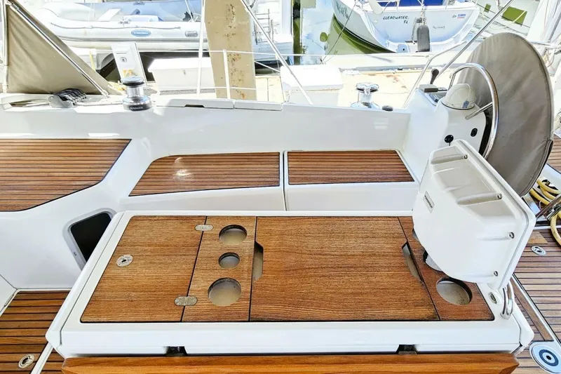 Slide: The Image of Cockpit of 2017 Jeanneau Sun Odyssey 51 with wooden deck and steering wheel. - 44