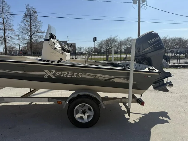 Slide: The Image of 2009 Xpress H20 BAY boat on trailer with Yamaha outboard motor. - 5