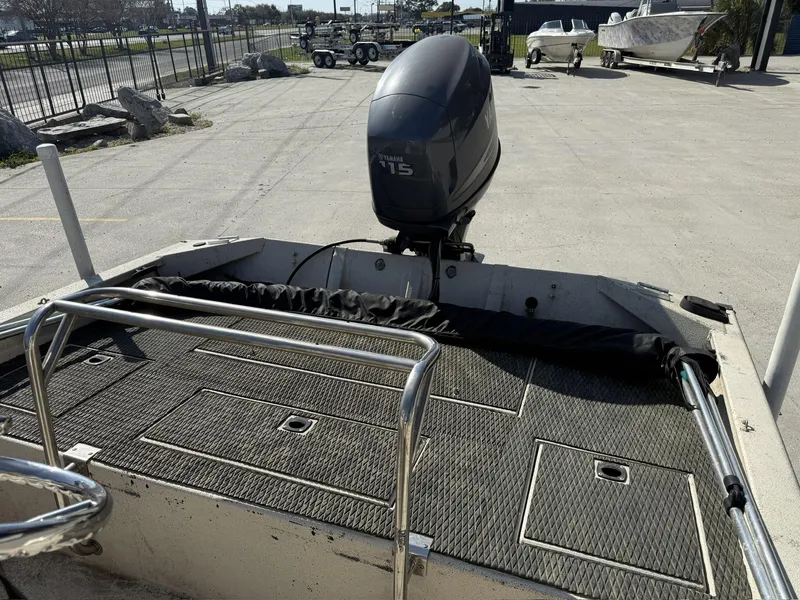 Slide: The Image of 2009 Xpress H20 BAY boat with Yamaha 115 engine, parked in a marina. - 7