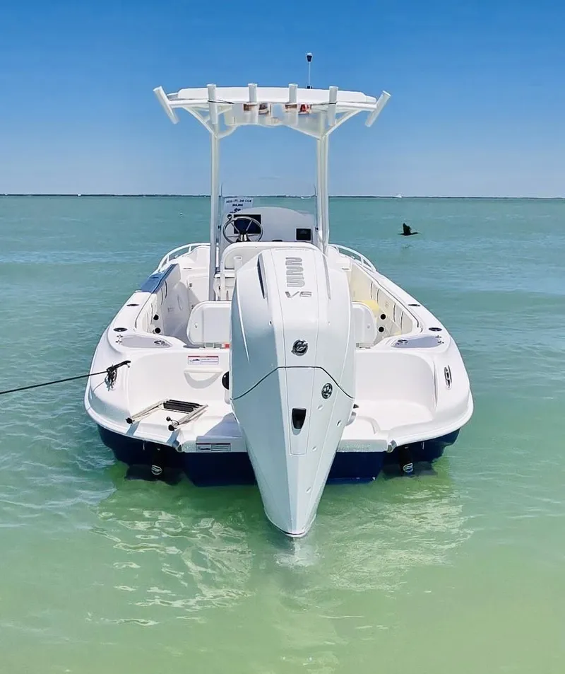 Slide: The Image of 2025 Glasstream 240 CCX boat in clear turquoise water, rear view. - 6