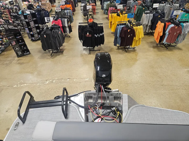Slide: The Image of Boat interior view in a clothing store, featuring a 2025 Lowe LS190 model. - 9