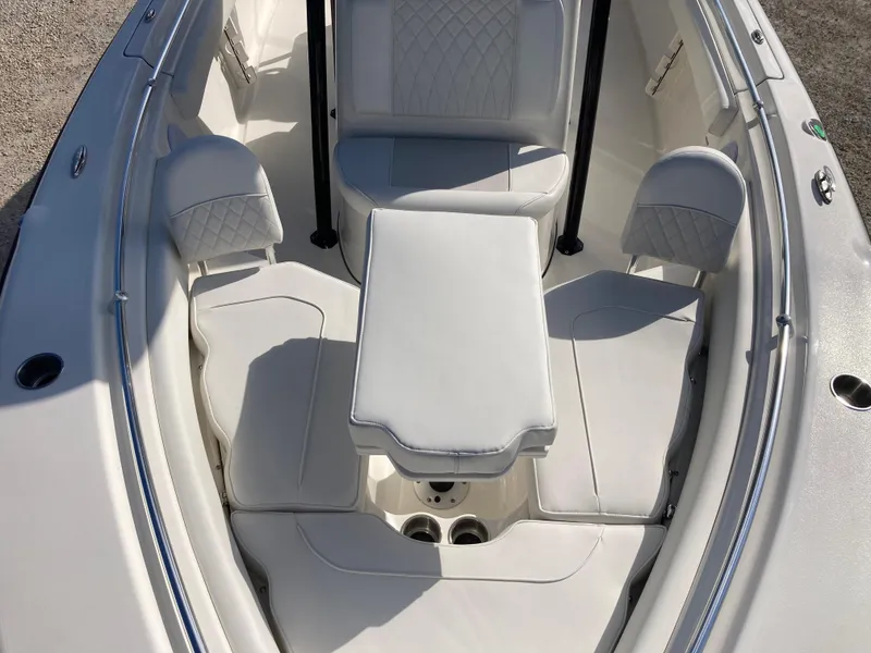 Slide: The Image of 2025 Key West 219fs boat interior with white seating and table. - 11