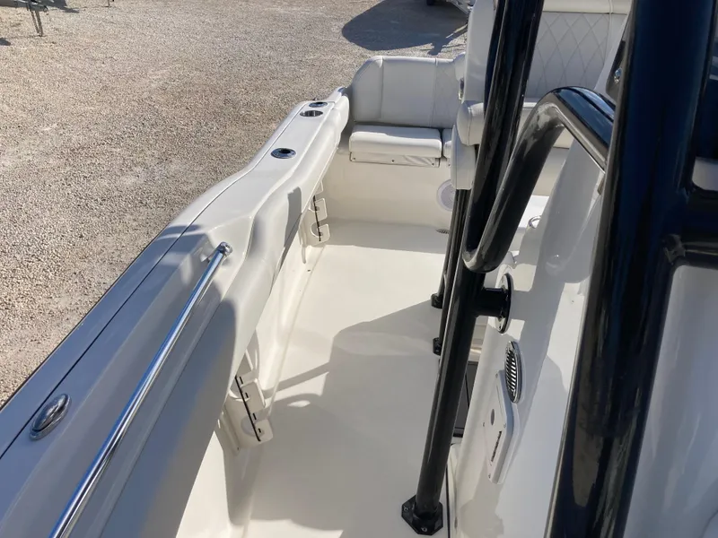 Slide: The Image of 2025 Key West 219fs boat interior with seating and railings. - 13