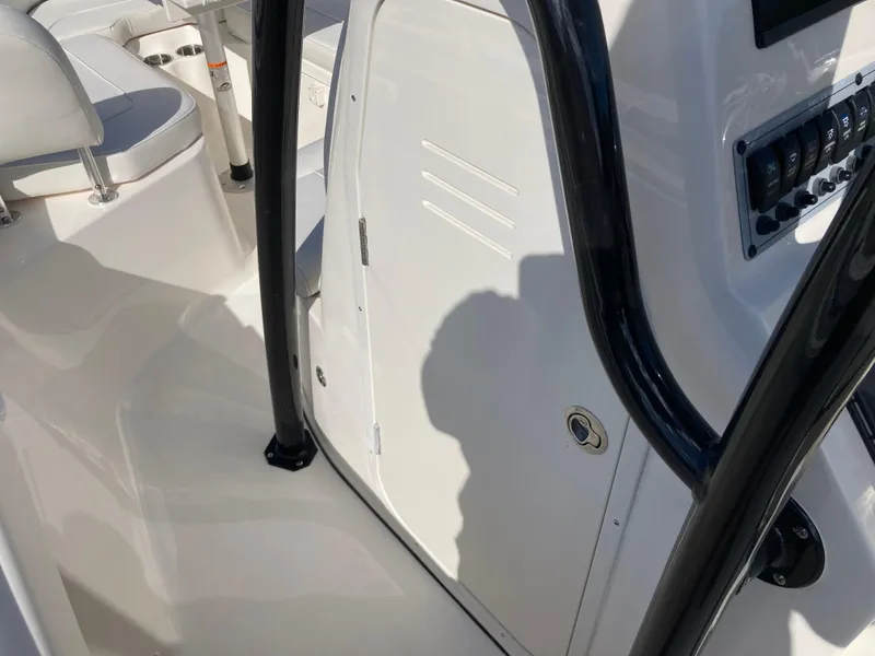 Slide: The Image of 2025 Key West 219fs boat interior with console and seating area. - 15