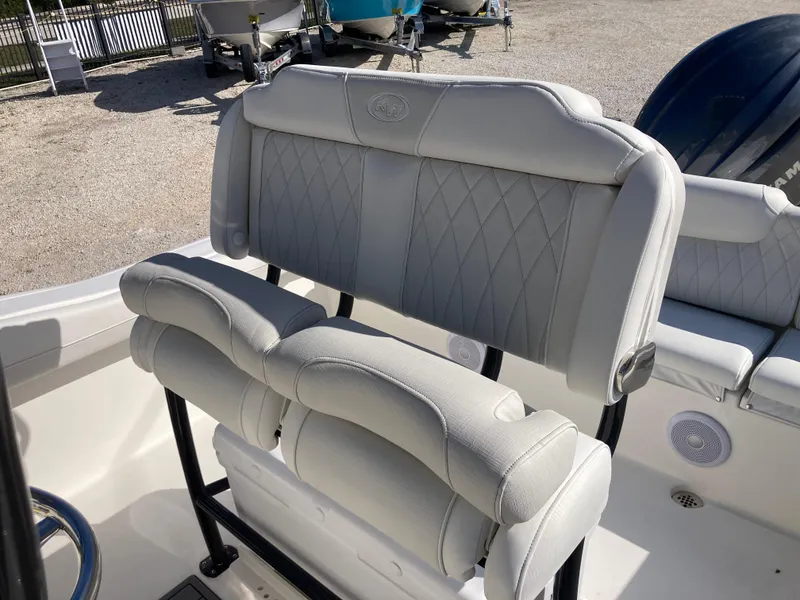 Slide: The Image of 2025 Key West 219fs boat with cushioned seating and sleek design. - 17