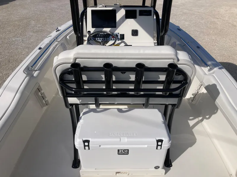 Slide: The Image of 2025 Key West 219fs boat interior with console, seating, and rod holders. - 6