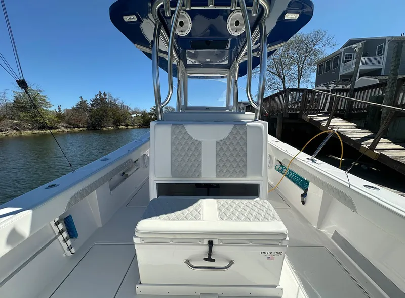 Slide: The Image of 2023 Front Runner 33 Center Console boat with sleek seating and modern design. - 12