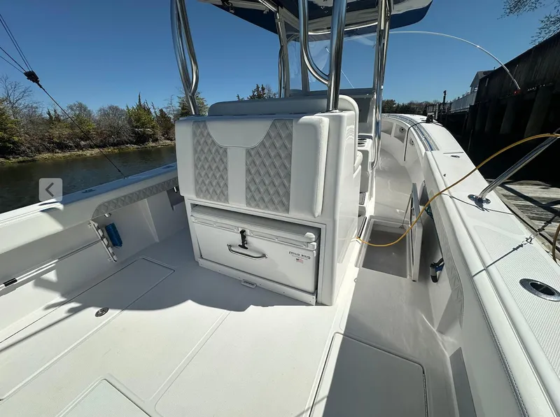 Slide: The Image of 2023 Front Runner 33 Center Console boat interior with seating and storage. - 14
